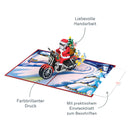 Biglietto pop-up con Babbo Natale su una motocicletta