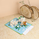 Biglietto pop-up con margherita e farfalla