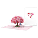 Biglietto pop-up con albero a forma di cuore e tortore